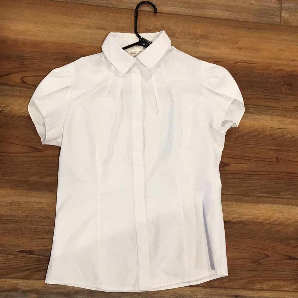 Women’s white cotton blouse with pleats.